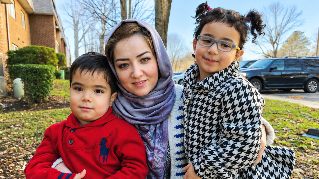 Mihrigul Tursun with her children, reflecting the personal impact of family separation faced by Uyghur communities.